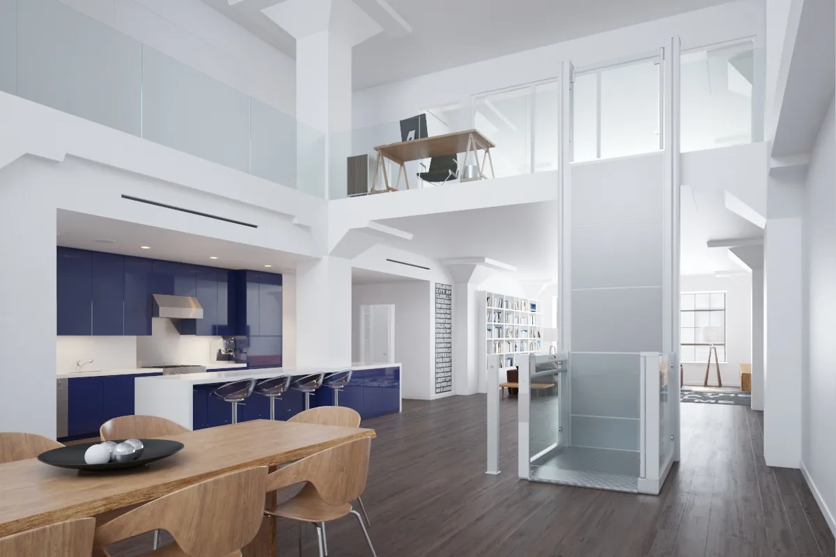 An open platform lift with glass gates rising to a mezzanine in a bright open plan home, beside a kitchen and dining table