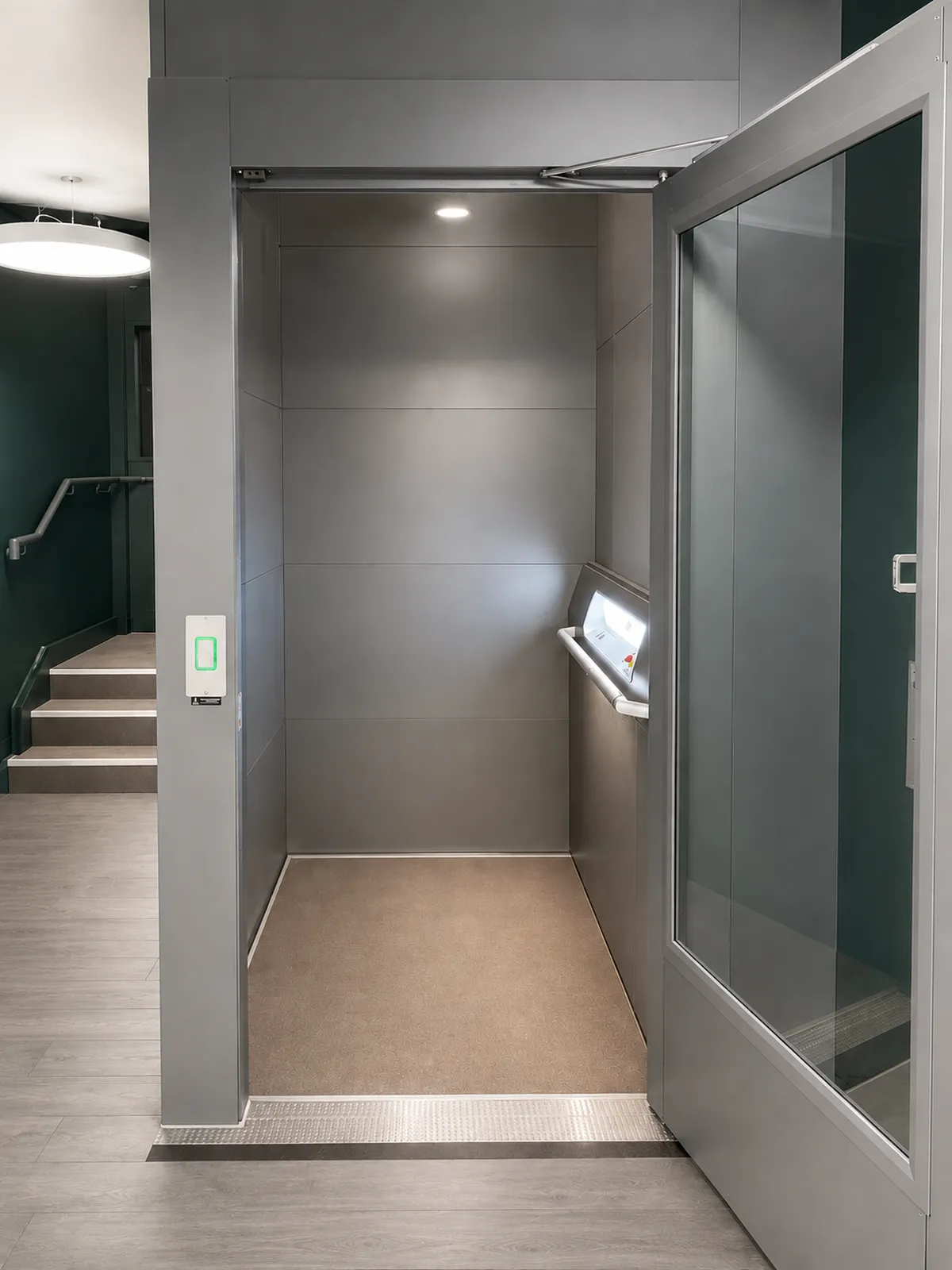 Lift cabin with automatic doors at the landing