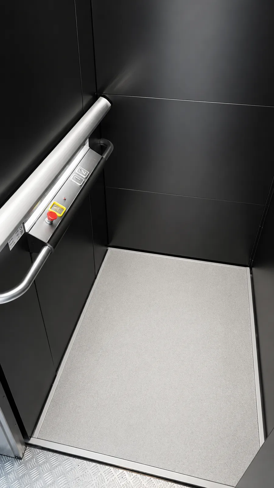Lift cabin interior with the illuminated ILS control panel